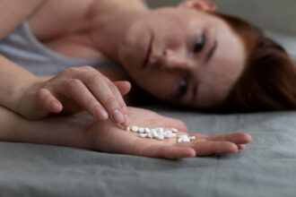 Close Up Depressed Woman Holding Pills